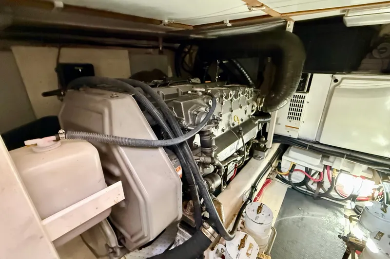 Slide: The Image of Engine room of a 2006 Sabre 42 Sedan yacht, showcasing mechanical components and wiring. - 25