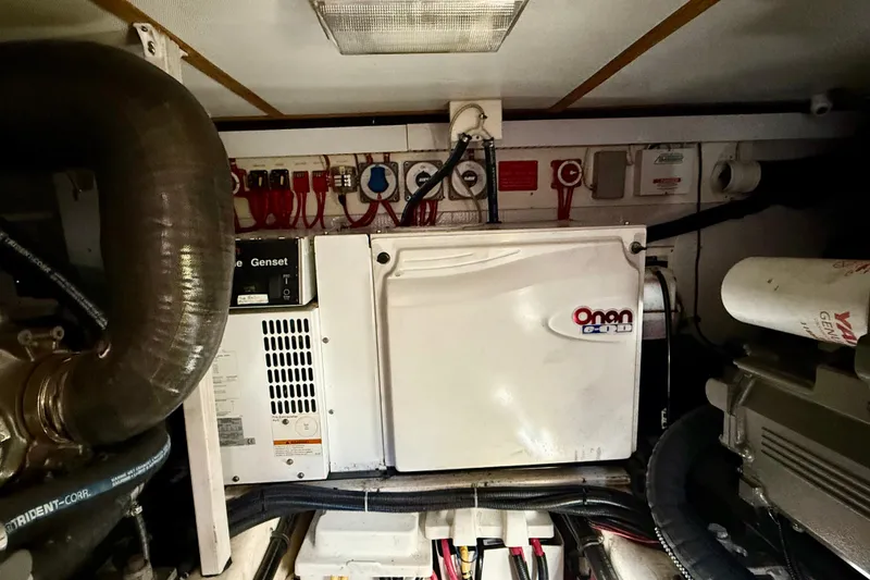 Slide: The Image of Engine room of 2006 Sabre 42 Sedan with Onan generator and wiring. - 27