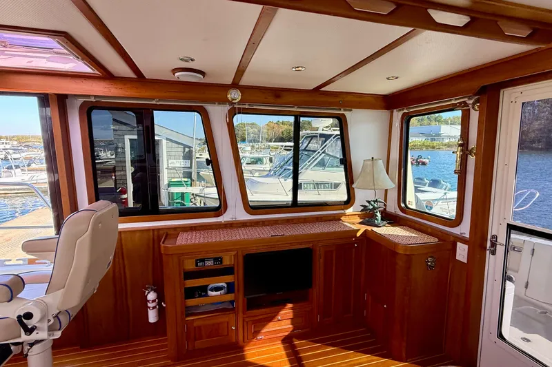Slide: The Image of Interior of 2006 Sabre 42 Sedan yacht with wood finish and marina view. - 49