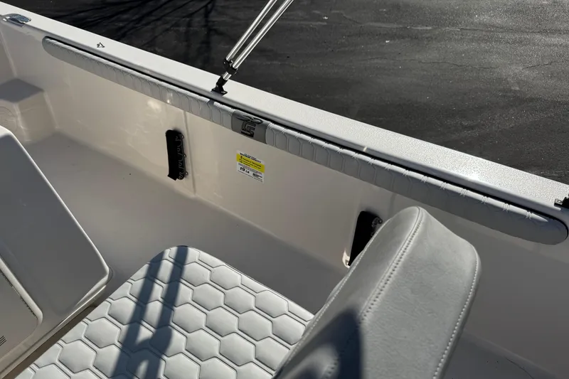 Slide: The Image of 2026 Carolina Skiff 19 LS boat interior with cushioned seating and sleek design. - 12