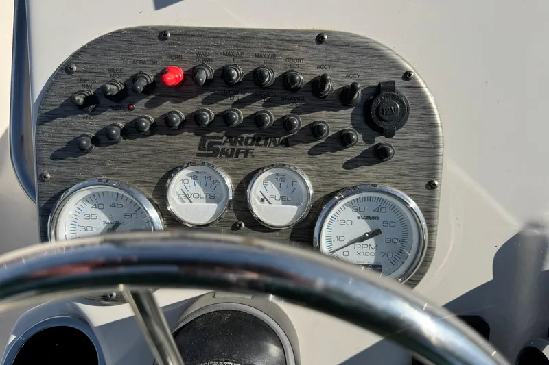 Slide: The Image of Dashboard of 2026 Carolina Skiff 19 LS boat with gauges and controls. - 5