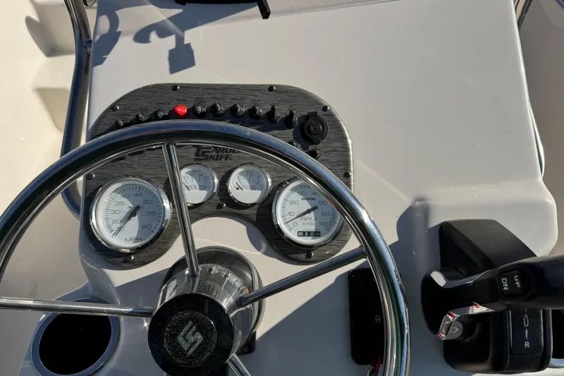 Slide: The Image of Steering console of 2026 Carolina Skiff 19 LS boat with gauges and controls. - 6