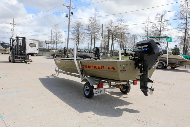 Slide: The Image of 2025 Tracker Grizzly 1436 Jon boat on trailer with Mercury outboard motor. - 3
