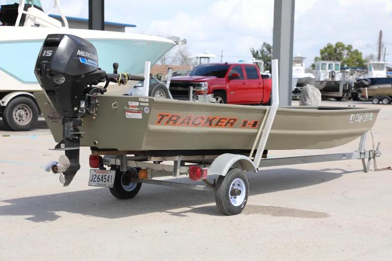Slide: The Image of 2025 Tracker Grizzly 1436 Jon boat on trailer with Mercury outboard motor. - 4