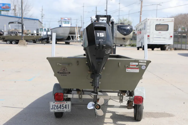 Slide: The Image of 2025 Tracker Grizzly 1436 Jon boat with Mercury 15 HP engine on trailer. - 5