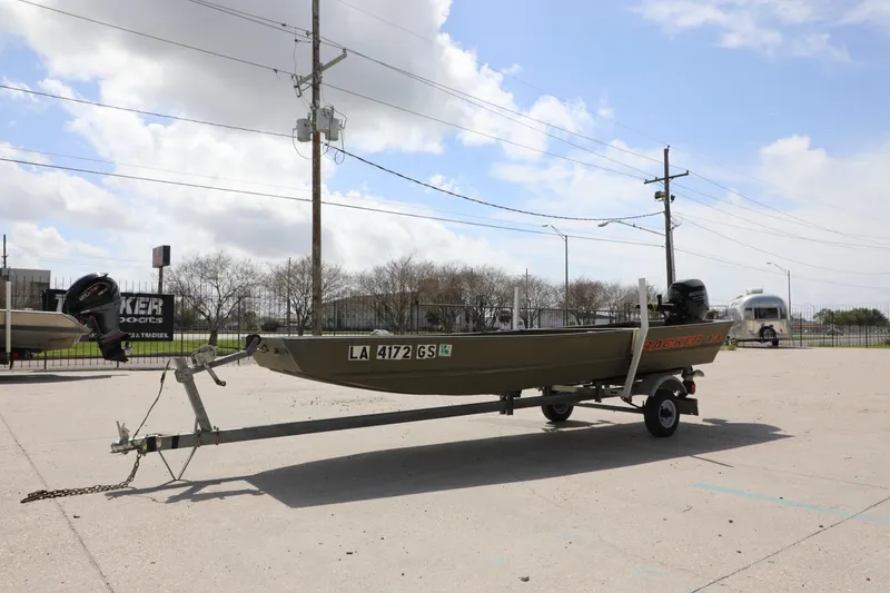 Slide: The Image of 2025 Tracker Grizzly 1436 Jon boat on trailer in outdoor setting. - 6