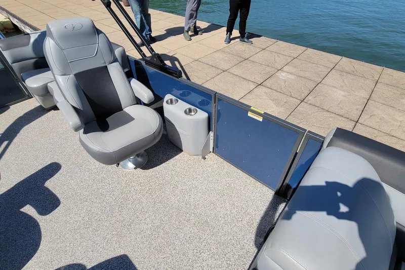 Slide: The Image of 2023 Veranda Relax VR20RC boat interior with comfortable seating and cup holders by the water. - 6
