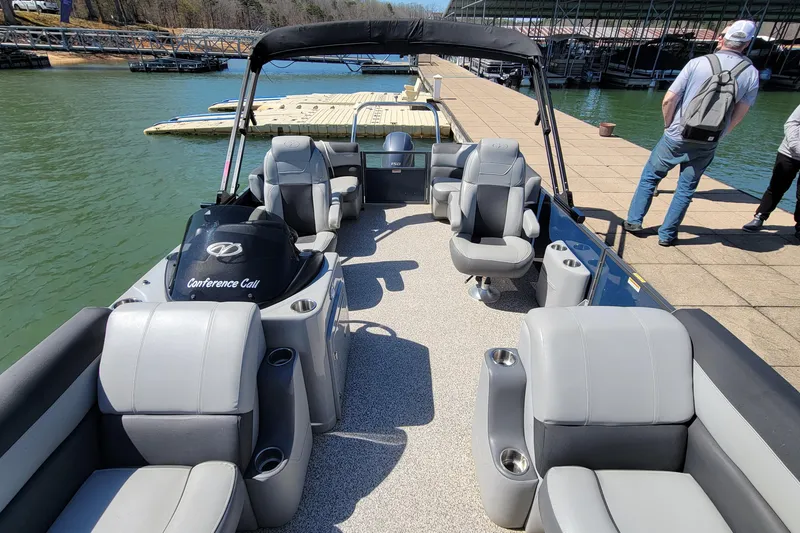 Slide: The Image of 2023 Veranda Relax VR20RC pontoon boat with spacious seating at a dock. - 7