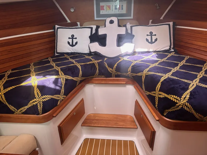 Slide: The Image of Interior of a 2009 Back Cove 33 with nautical decor. - 18