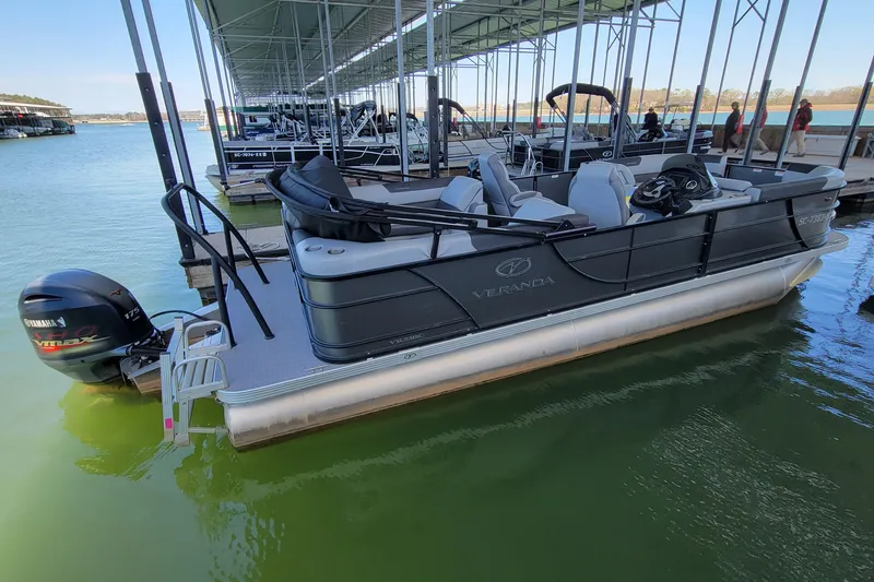 Slide: The Image of 2023 Veranda Relax VR22RC pontoon boat docked with Yamaha VMAX engine. - 3