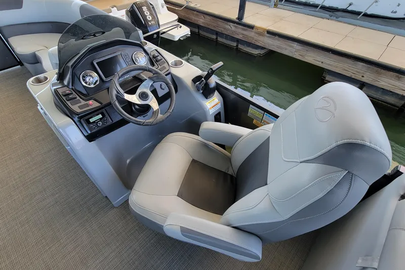 Slide: The Image of 2023 Veranda Relax VR22RC boat helm with steering wheel and captain's chair. - 9