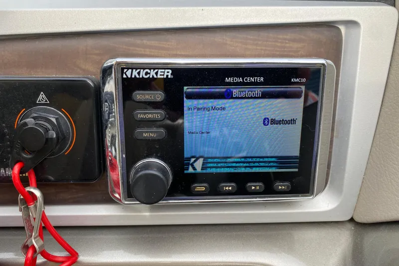 Slide: The Image of Kicker media center with Bluetooth pairing on 2016 Manitou 25 Legacy LT SHP. - 24