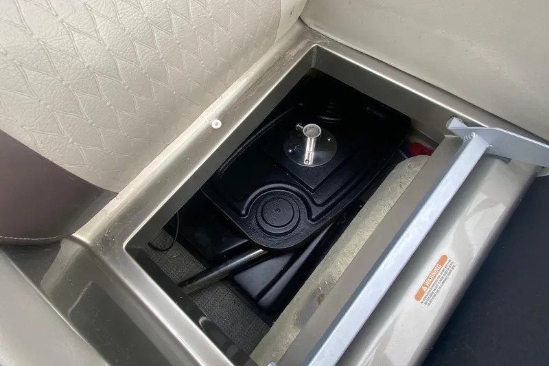 Slide: The Image of Storage compartment of a 2016 Manitou 25 Legacy LT SHP boat, showcasing interior details. - 35