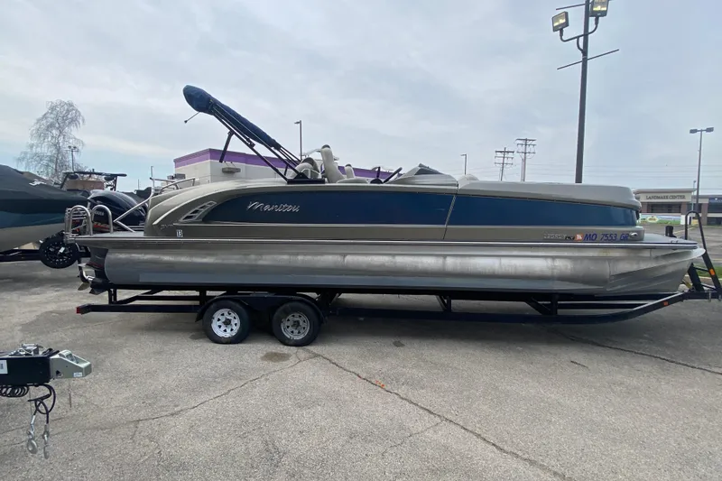 Slide: The Image of 2016 Manitou 25 Legacy LT SHP pontoon boat on trailer in parking lot. - 41