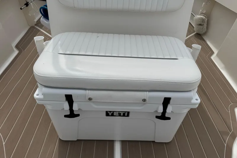 Slide: The Image of White YETI cooler with cushioned seat on 2004 Boston Whaler 190 Nantucket boat. - 10