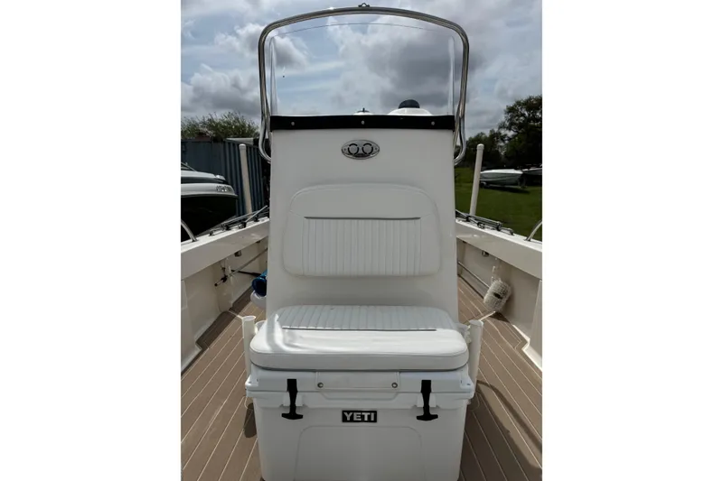 Slide: The Image of 2004 Boston Whaler 190 Nantucket boat interior with Yeti cooler and seating. - 12