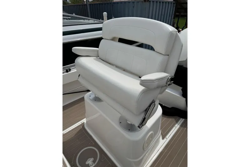 Slide: The Image of White cushioned seat on 2004 Boston Whaler 190 Nantucket boat deck. - 15