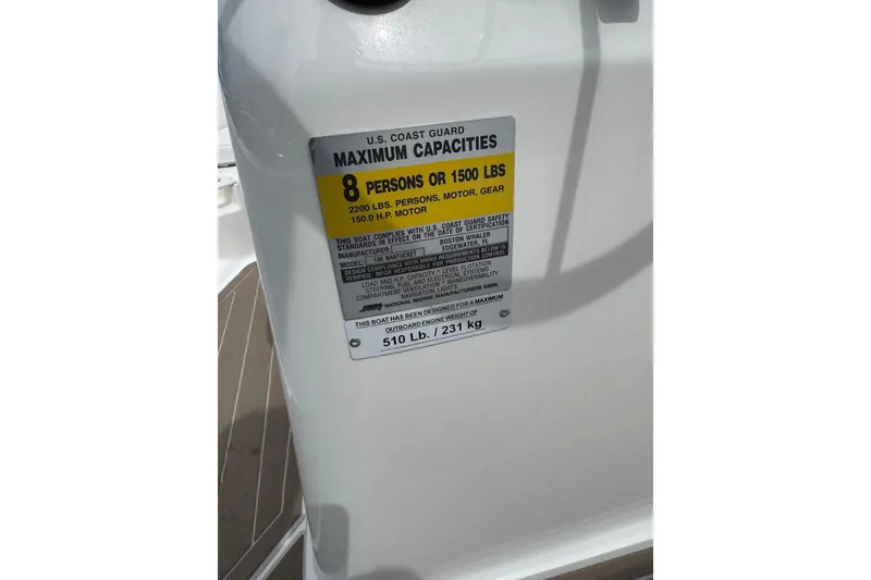 Slide: The Image of 2004 Boston Whaler 190 Nantucket capacity label, 8 persons or 1500 lbs limit. - 17