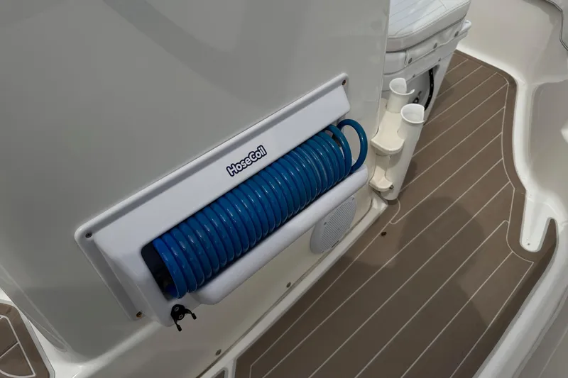 Slide: The Image of 2004 Boston Whaler 190 Nantucket boat deck with HoseCoil storage system. - 7