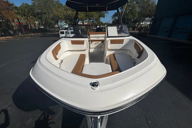 Slide: The Image of 2021 Bayliner VR6 Bowrider OB with spacious seating and sleek design. - 2