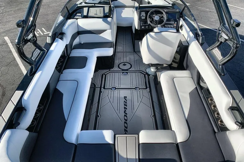 Slide: The Image of 2026 Moomba Mojo boat interior with sleek seating and modern dashboard design. - 10