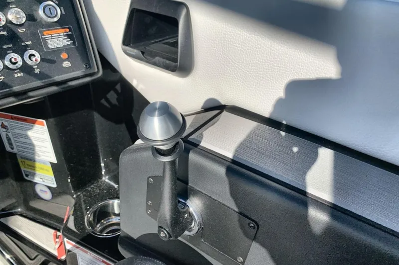 Slide: The Image of 2026 Moomba Mojo boat control panel with throttle lever and dashboard controls. - 16