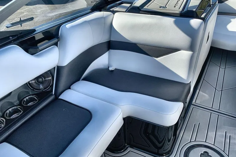 Slide: The Image of 2026 Moomba Mojo boat interior with sleek black and white seating design. - 17