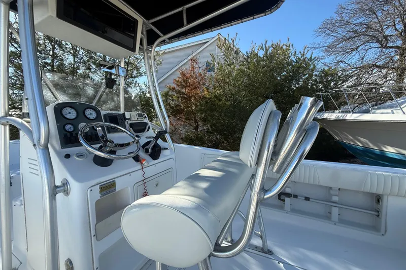 Slide: The Image of 2007 Sea Hunt Triton 220 boat interior with steering console and seating. - 14