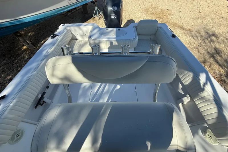 Slide: The Image of 2007 Sea Hunt Triton 220 boat interior with seating and rod holders. - 17