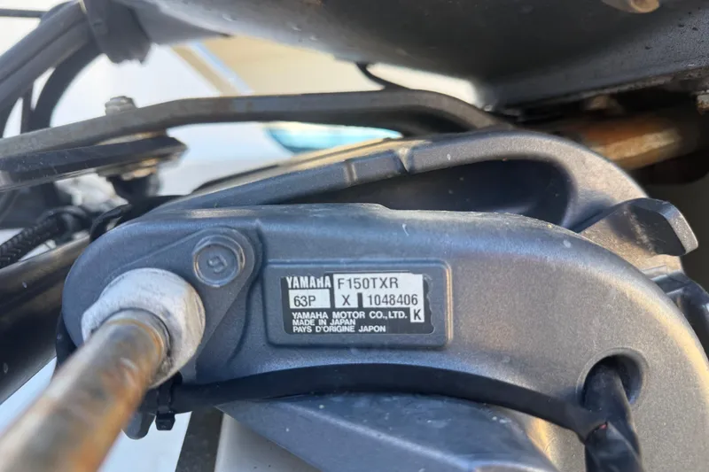 Slide: The Image of Close-up of Yamaha F150TXR engine part on 2007 Sea Hunt Triton 220 boat. - 6
