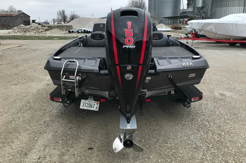 Slide: The Image of 2022 Ranger Z185 boat with Mercury 150 Pro motor, parked on gravel. - 17