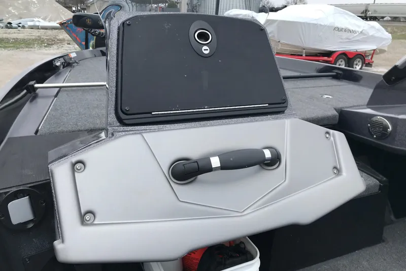 Slide: The Image of 2022 Ranger Z185 boat interior with storage compartment and handle. - 32