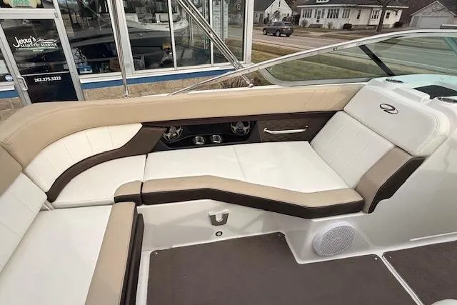 Slide: The Image of 2012 Regal 24 FasDeck boat interior with beige and white seating, modern design. - 11