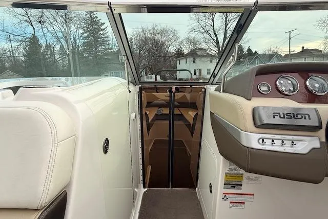 Slide: The Image of Interior view of a 2012 Regal 24 FasDeck boat with dashboard and seating. - 13