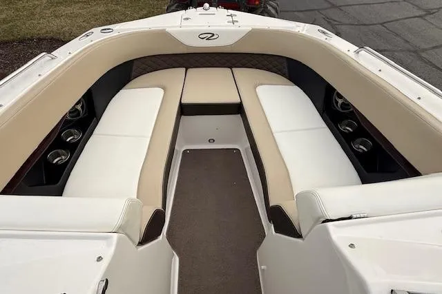 Slide: The Image of 2012 Regal 24 FasDeck boat interior with beige and white seating arrangement. - 14