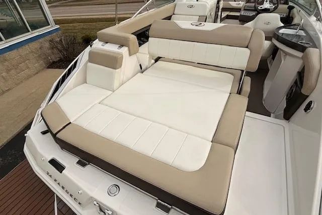 Slide: The Image of 2012 Regal 24 FasDeck boat interior with beige and white seating. - 21
