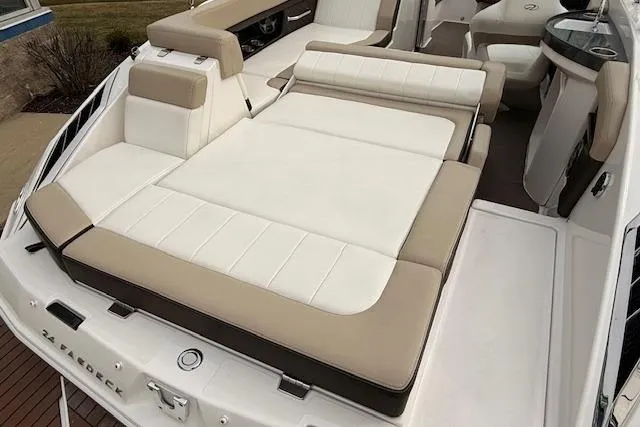 Slide: The Image of 2012 Regal 24 FasDeck boat with spacious, cushioned seating area. - 22