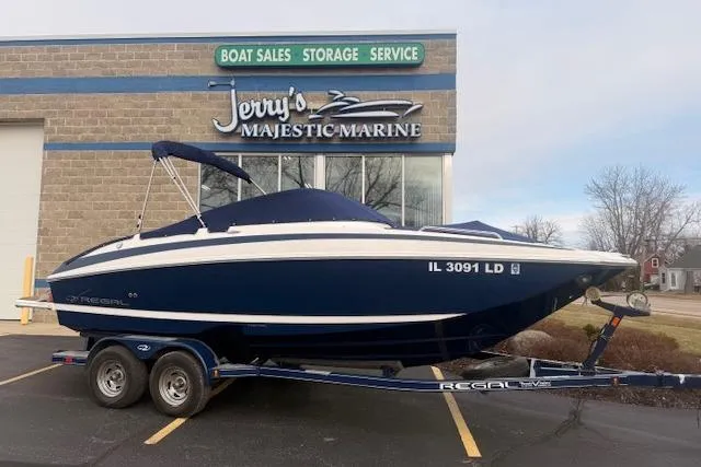 Slide: The Image of 2012 Regal 24 FasDeck boat on trailer at Jerry's Majestic Marine dealership. - 29