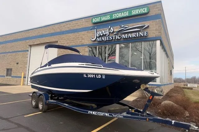 Slide: The Image of 2012 Regal 24 FasDeck boat on trailer at Jerry's Majestic Marine dealership. - 30