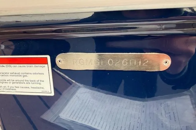 Slide: The Image of 2012 Regal 24 FasDeck boat identification plate with warning label. - 32