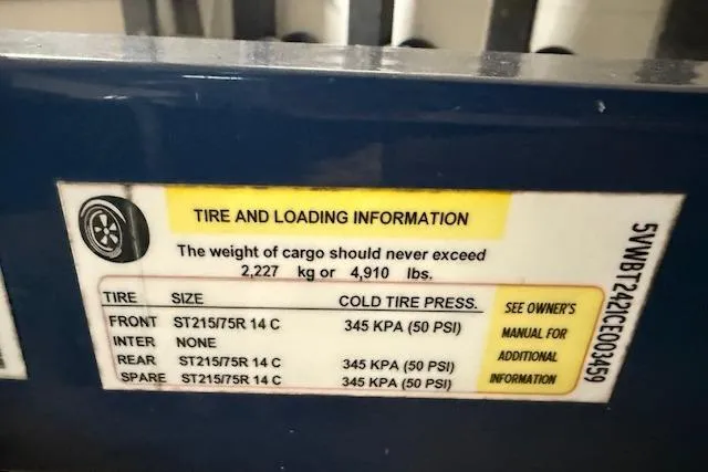Slide: The Image of Tire and loading information label for 2012 Regal 24 FasDeck, showing weight and pressure details. - 34