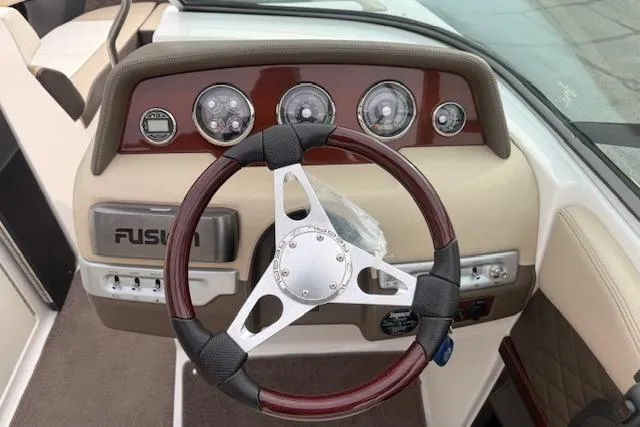 Slide: The Image of Steering wheel and dashboard of 2012 Regal 24 FasDeck boat. - 7
