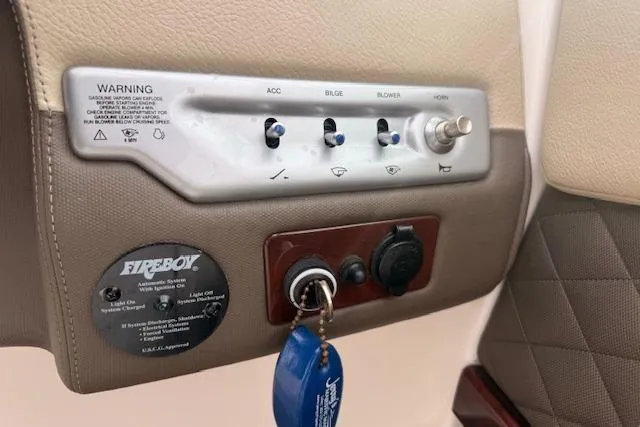 Slide: The Image of Control panel of a 2012 Regal 24 FasDeck boat with ignition and switches. - 9