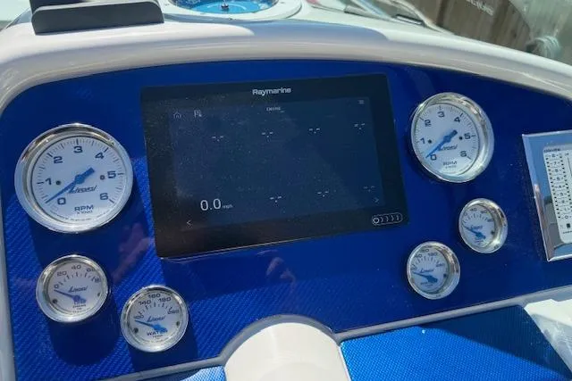 Slide: The Image of Dashboard of a 2007 Formula 353 FASTech boat with gauges and Raymarine display. - 30