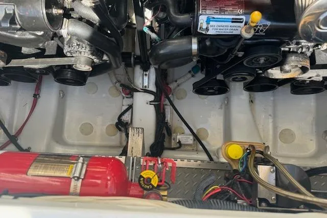 Slide: The Image of Engine compartment of a 2007 Formula 353 FASTech boat with visible components and fire extinguisher. - 36