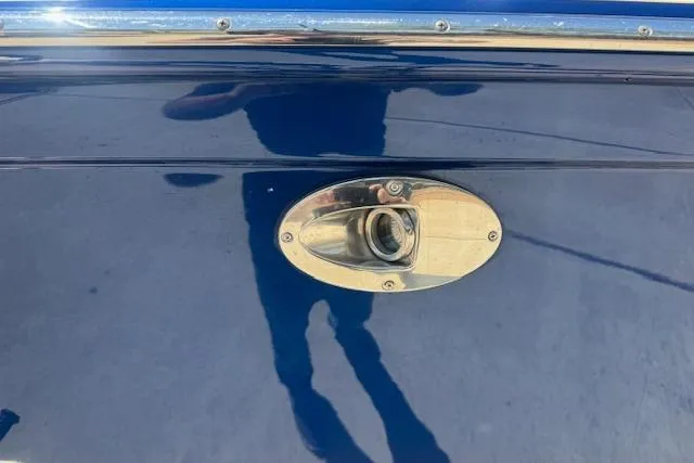 Slide: The Image of 2007 Formula 353 FASTech boat fuel cap on sleek blue exterior. - 4