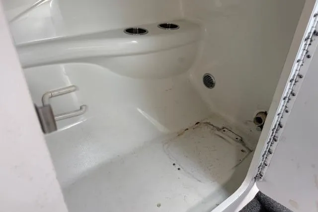 Slide: The Image of 2007 Formula 353 FASTech boat interior with cup holders and storage space. - 40