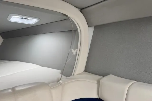 Slide: The Image of Interior cabin of a 2007 Formula 353 FASTech boat, featuring sleek white and gray upholstery. - 47