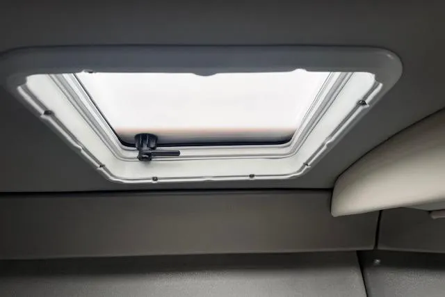 Slide: The Image of 2007 Formula 353 FASTech cabin skylight with a closed hatch and handle. - 48