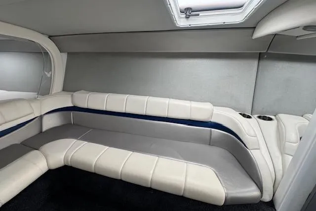 Slide: The Image of 2007 Formula 353 FASTech boat interior with white and gray seating, skylight above. - 49